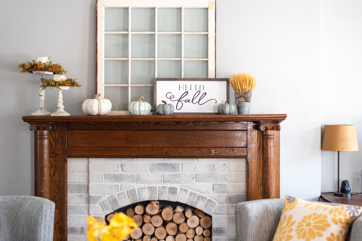 decorating the mantle with autumn decor.